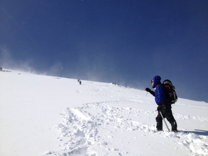 Romping down the summit snowfields in fresh powder...